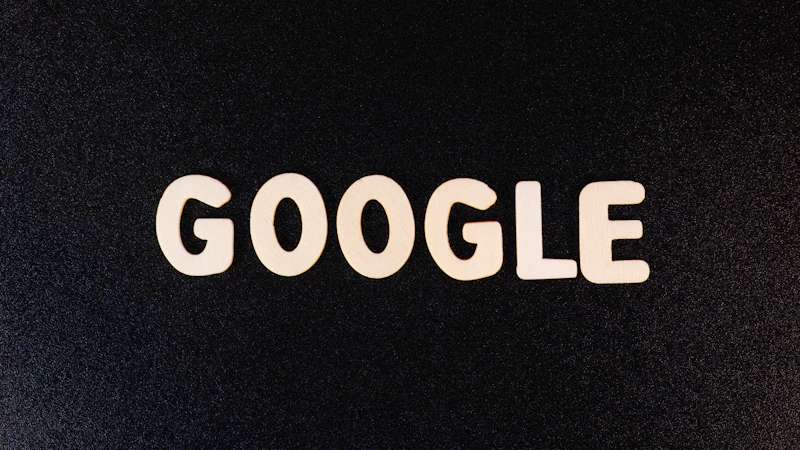 a close up of the word google on a black surface