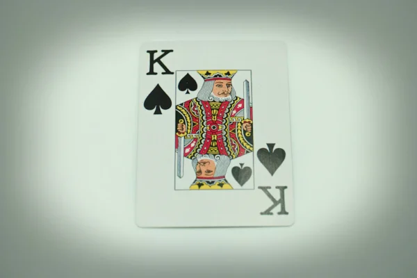 a playing card with a king of hearts on it