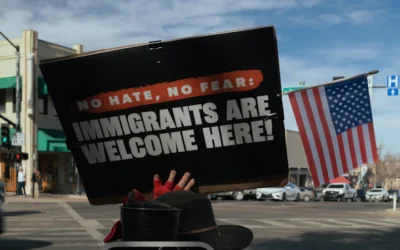 Protest sign reads immigrants are welcome here
