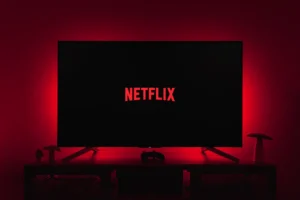 a television with the netflix logo lit up in the dark