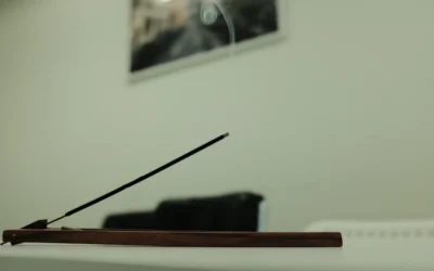 a close up of a wooden table with a black chair in the background
