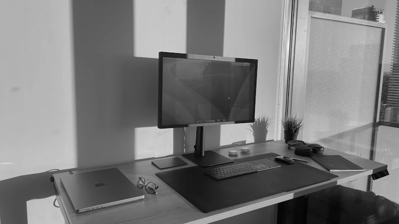 a computer monitor sitting on top of a desk