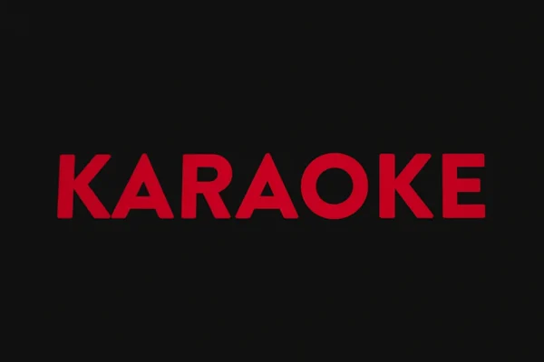 A red karaoke logo on a black background