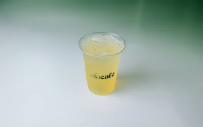A plastic cup with a drink inside of it