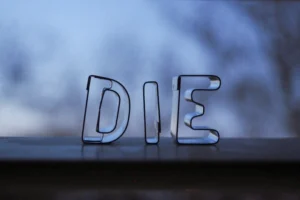 gray letter b on black surface