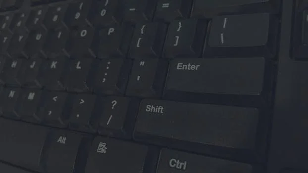 Detailed shot of black computer keyboard showcasing various keys for technology concepts.