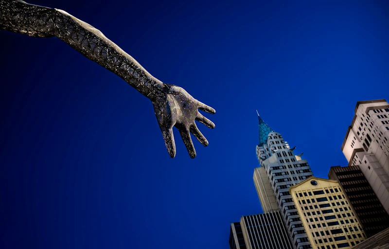 black eagle statue near white concrete building under blue sky during daytime