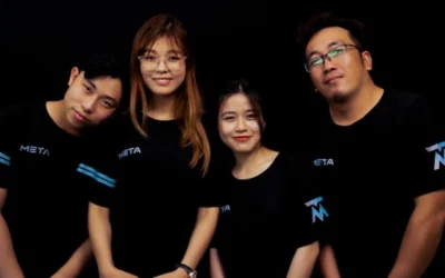Four diverse young adults in META logo T-shirts against a black background.