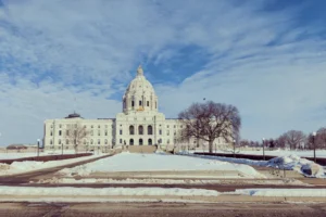 A large white building sitting on top of a snow covered field