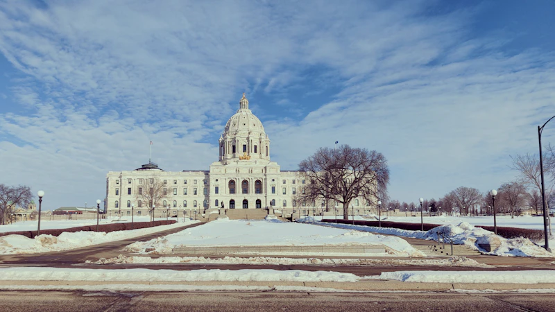 A large white building sitting on top of a snow covered field
