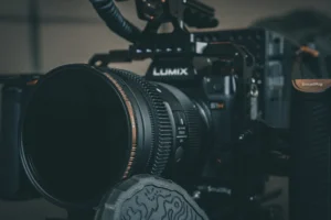 black nikon dslr camera on black table
