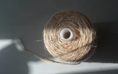 a spool of twine of twine on a white surface