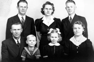 a black and white photo of a family