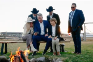 a group of people sitting around a fire pit