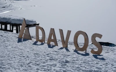 a wooden sign that reads davos in the snow