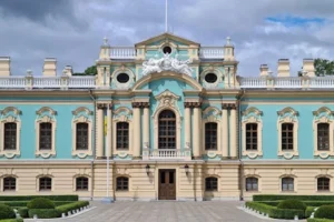 Front view of a beautifully preserved Baroque palace with intricate architectural details and vibrant colors.
