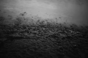 Dark water surface in black and white.