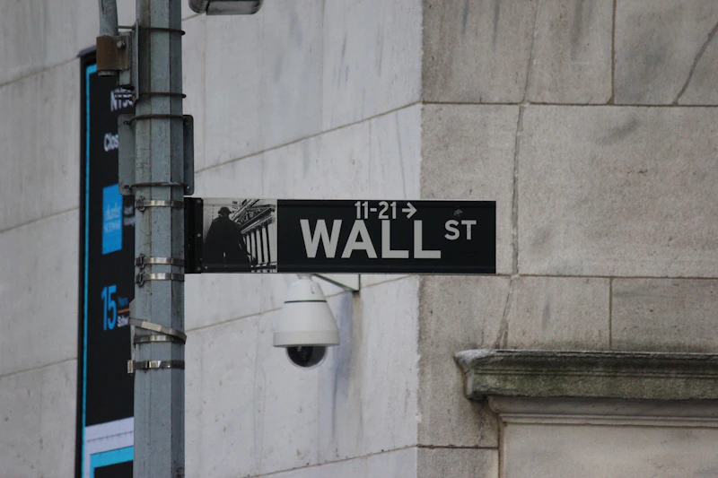 A street sign on the corner of wall street