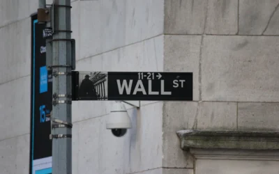 A street sign on the corner of wall street