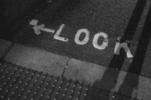 Look sign painted on asphalt road