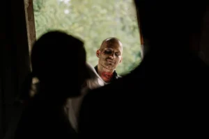 A chilling scene with a zombie peering through a doorway, perfect for horror themes.