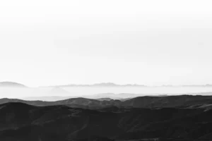 a black and white photo of a mountain range