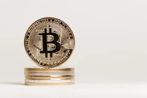 Golden Bitcoin displayed prominently on a white background showcasing cryptocurrency value.