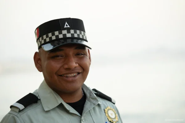 A smiling officer wearing a uniform.