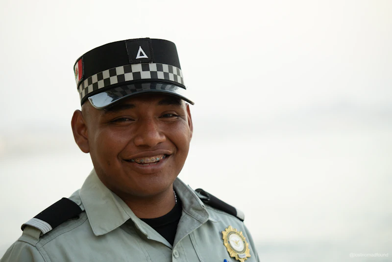 A smiling officer wearing a uniform.