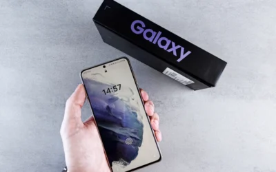 a person holding a cell phone in their hand