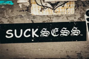 a black and white street sign on a wall