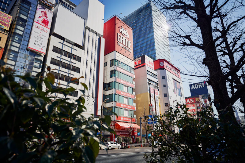 a city street filled with tall buildings next to trees