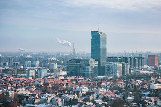Panoramic aerial cityscape of Gdansk with skyscrapers and rooftops during winter.