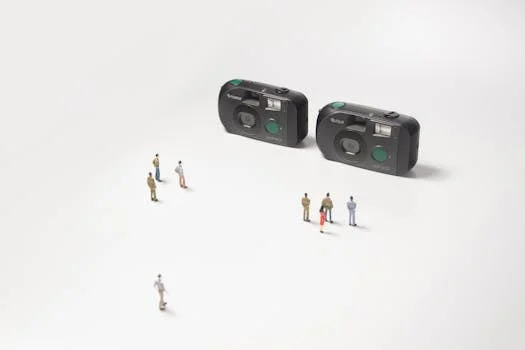 Creative scene with tiny people and classic cameras on a white surface, highlighting photography nostalgia.