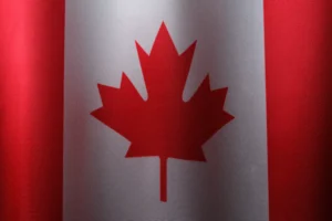 a canadian flag with a red maple leaf on it