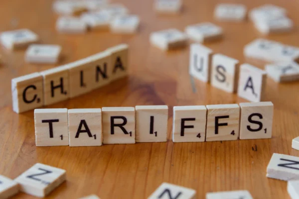 A close up of scrabble tiles spelling the word china