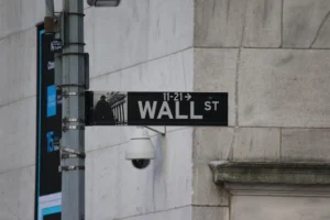 A street sign on the corner of wall street