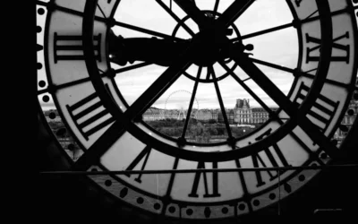 A black and white photo of a large clock
