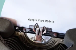 Close-up of a typewriter typing 'Google Core Update' on paper, symbolizing digital advancement.