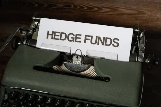 Close-up of a vintage typewriter with a paper labeled 'Hedge Funds'.