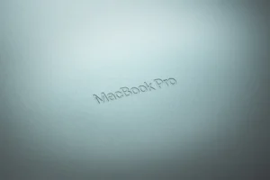 a close up of a macbook pro logo