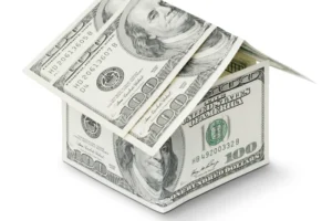 a house made out of money on a white background